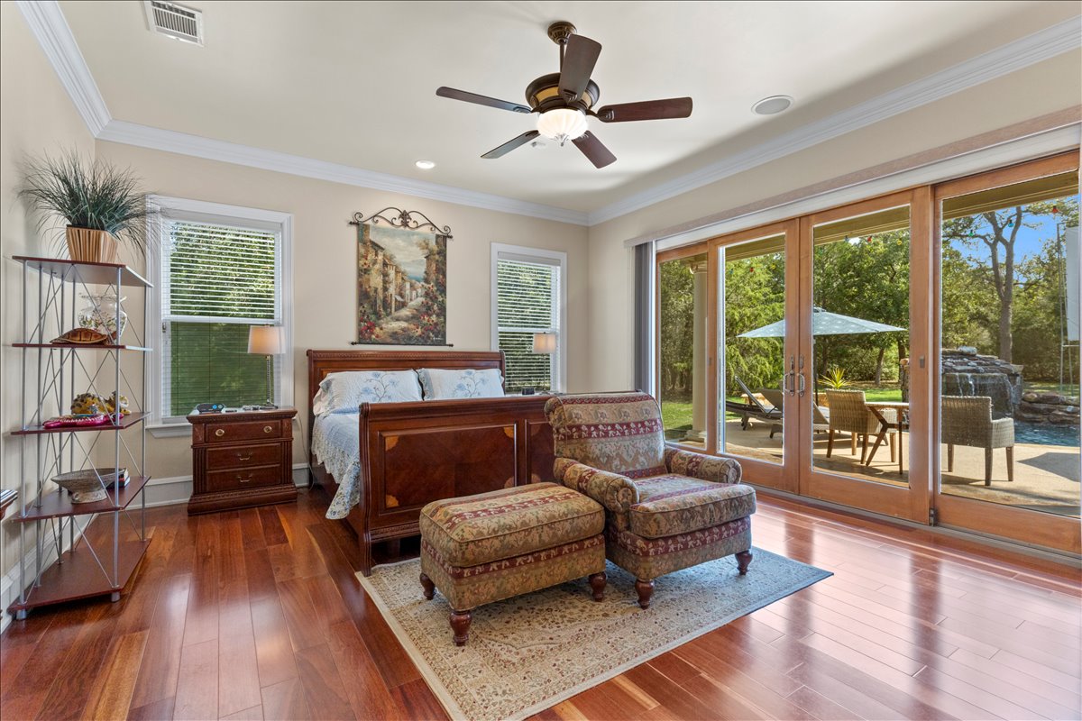 Master bedroom with French doors to pool
