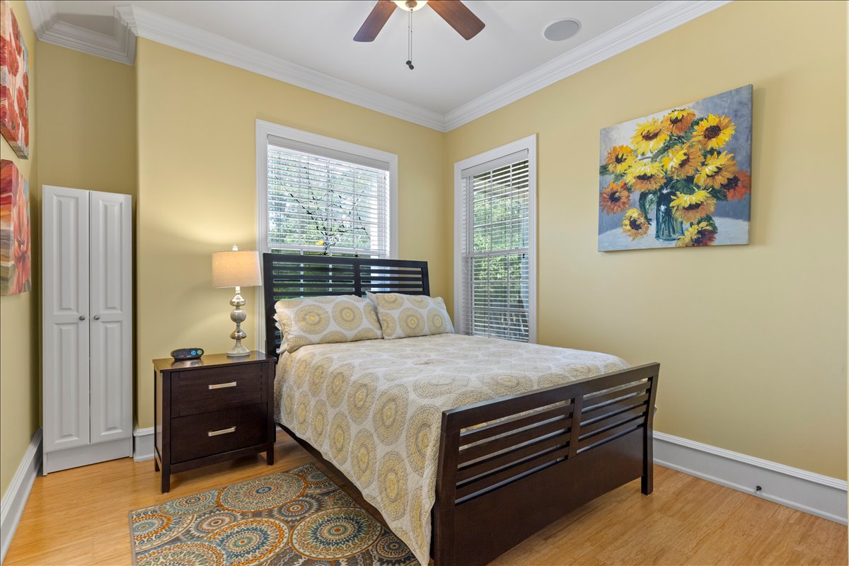 Queen bedroom with hardwood floors